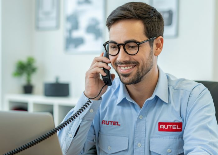Autel US Support technician assisting a customer over the phone.