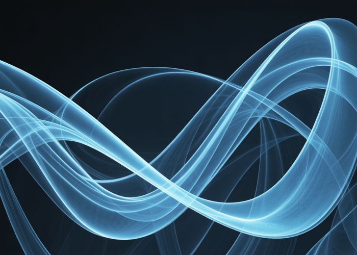 Abstract swirling blue light waves on a dark background.