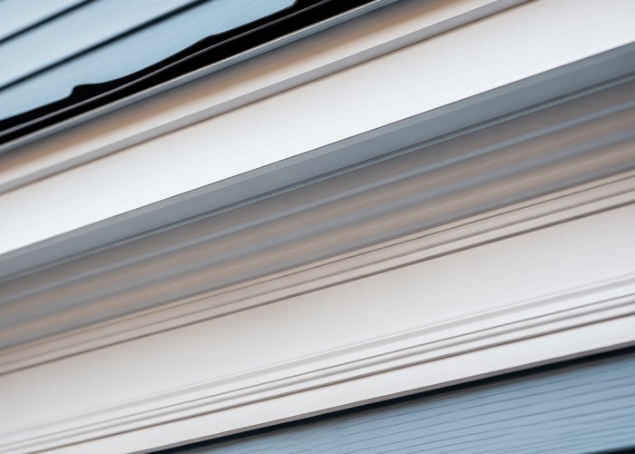 Close-up of painted white PVC trim showing a smooth and flawless finish.