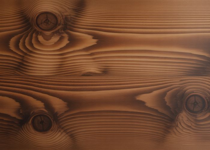 Close-up of stained poplar wood grain with rich color variation.