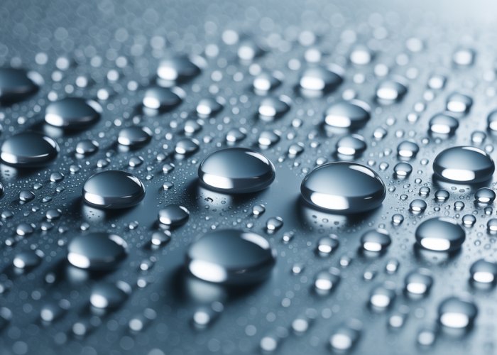 Close-up of water droplets condensing on a cold glass.