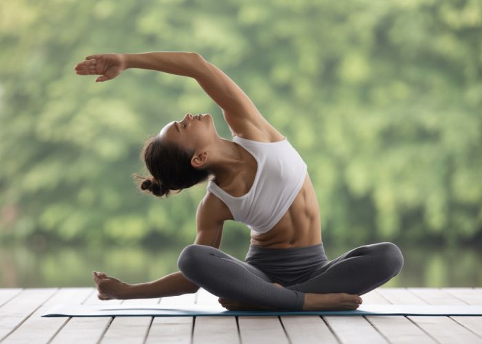 Person performing activated isolated stretching, demonstrating proper form and muscle engagement.