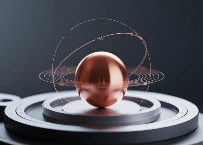 Visual representation of copper's atomic radius, showing a copper sphere and a model of its atomic structure.