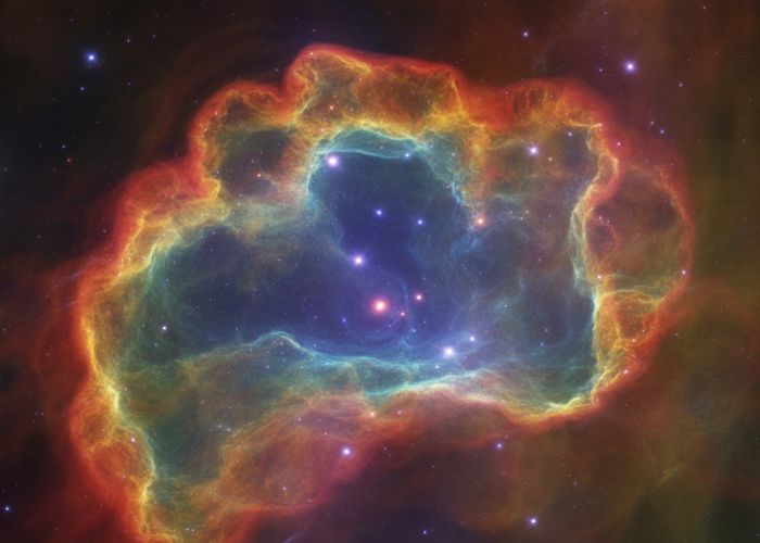 Colorful nebula with swirling gas and dust, showcasing the beauty of a galaxy.
