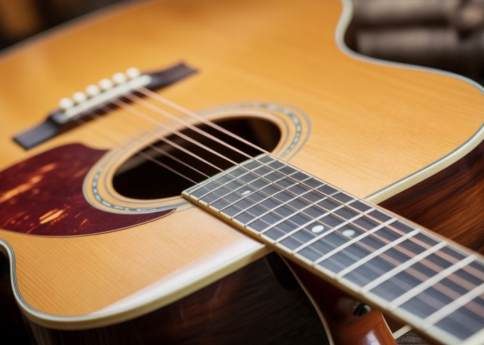Acoustic guitar tuned to Nashville tuning, showing the thinner gauge strings.