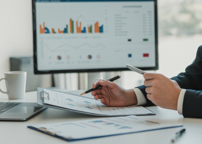 Accountant analyzing financial statements to find relevant accounting information.