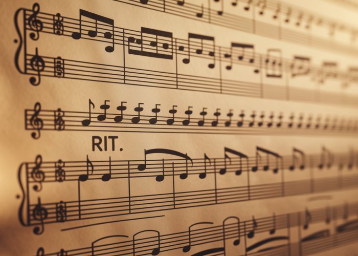Musical score with 'rit.' marking, indicating a slowing of tempo (ritardando).