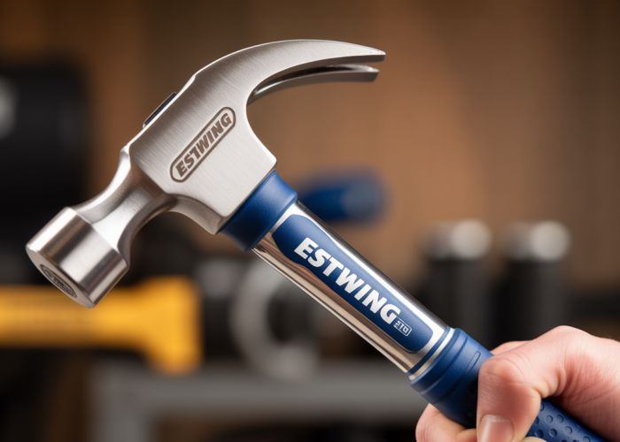 Titanium Estwing hammer close up, highlighting its lightweight construction and shock reduction grip.